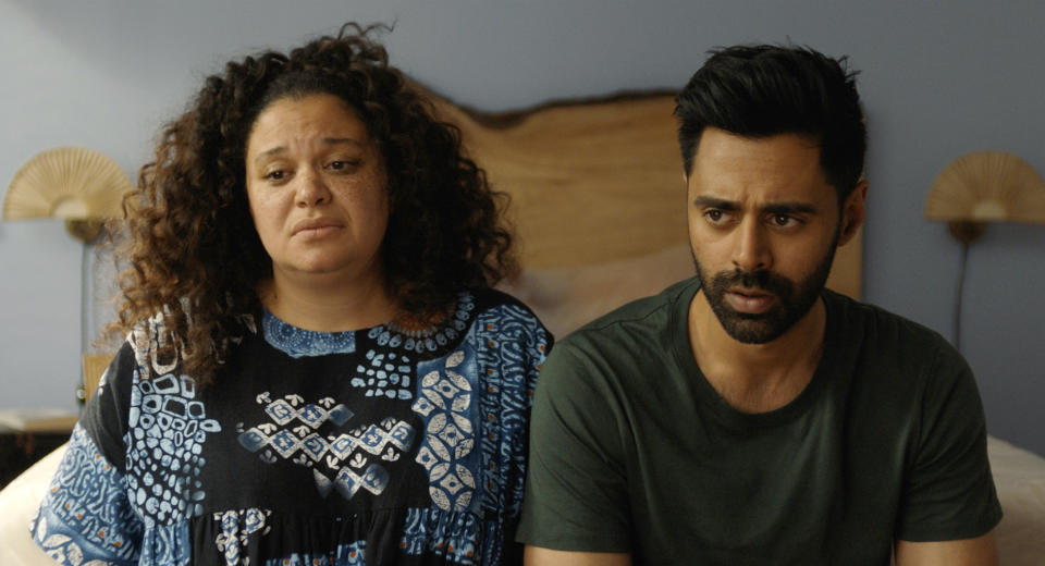 This image released by Neon shows Michelle Buteau, left, and Hasan Minhaj in a scene from the film "Babes." (Neon via AP)