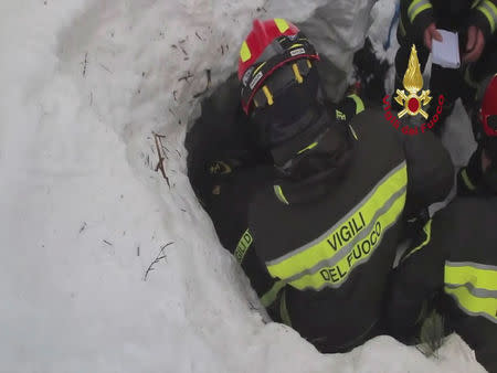 Firefighters rescue a survivor from Hotel Rigopiano in Farindola, central Italy, which was hit by an avalanche, in this handout picture released on January 20, 2017 by Italy's Fire Fighters. Vigili del Fuoco/Handout via REUTERS