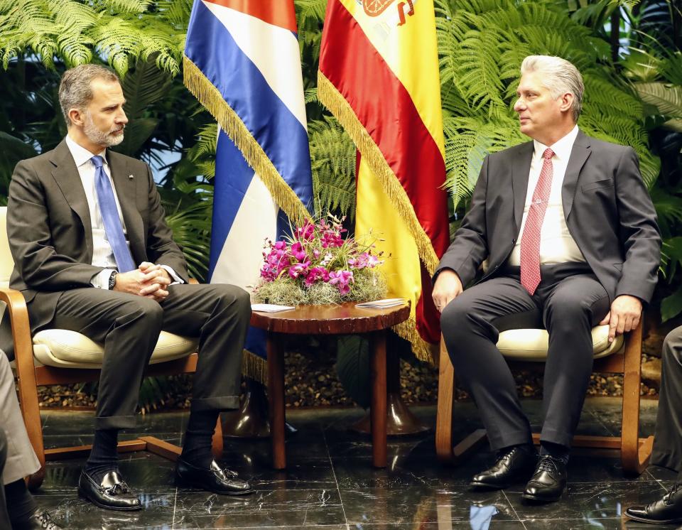 Spain's King Felipe VI, left, listens to Cuba's President Miguel Diaz-Canel during a meeting at the Revolution Palace in Havana, Cuba, Tuesday, Nov. 12, 2019. Spain's kings are in Havana in an official visit. (Ernesto Mastrascusa/Pool photo via AP)