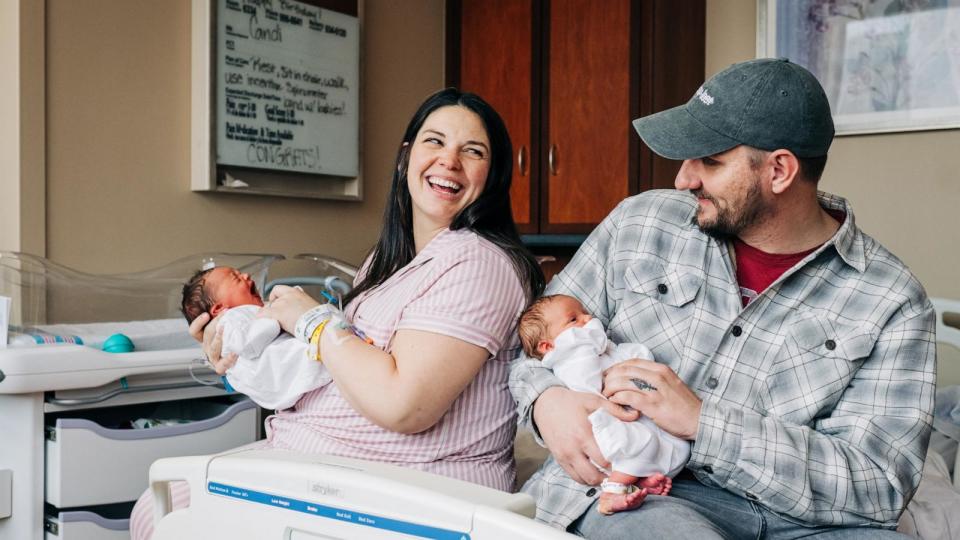 PHOTO: Kelsey Hatcher, and her husband, Caleb, holds twin daughters, Dec. 21, 2023, at the University of Alabama at Birmingham.  (Andrea Mabry/University of Alabama at Birmingham/AFP via Getty Images)