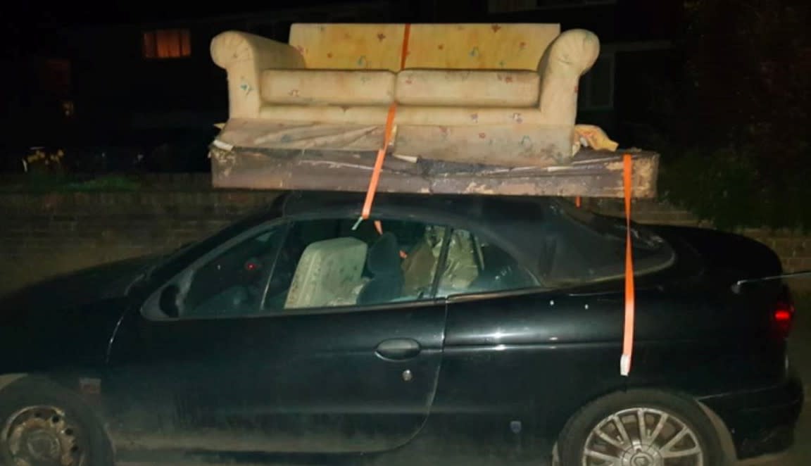 Motorist Matthew Dummer was spotted driving with a sofa on the roof of his convertible car. (SWNS)