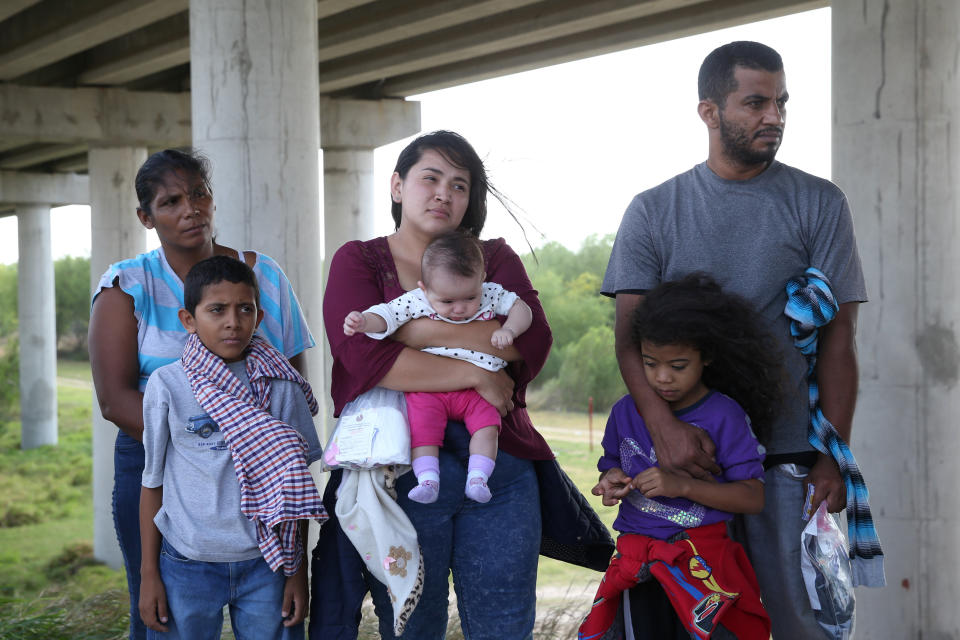 Undocumented immigrants who turned themselves in after crossing the border from Mexico into the U.S. await processing near McAllen, Texas,&nbsp;on April 2, 2018.