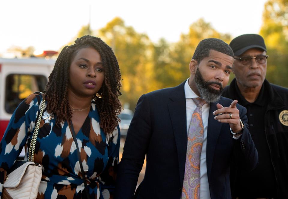 Jackson Mayor Chokwe Antar Lumumba, right, and his wife Ebony Lumumba, left, arrive for his State of the City address at the Farish Street Courtyard in Jackson, Miss., Thursday, Oct. 27, 2022.