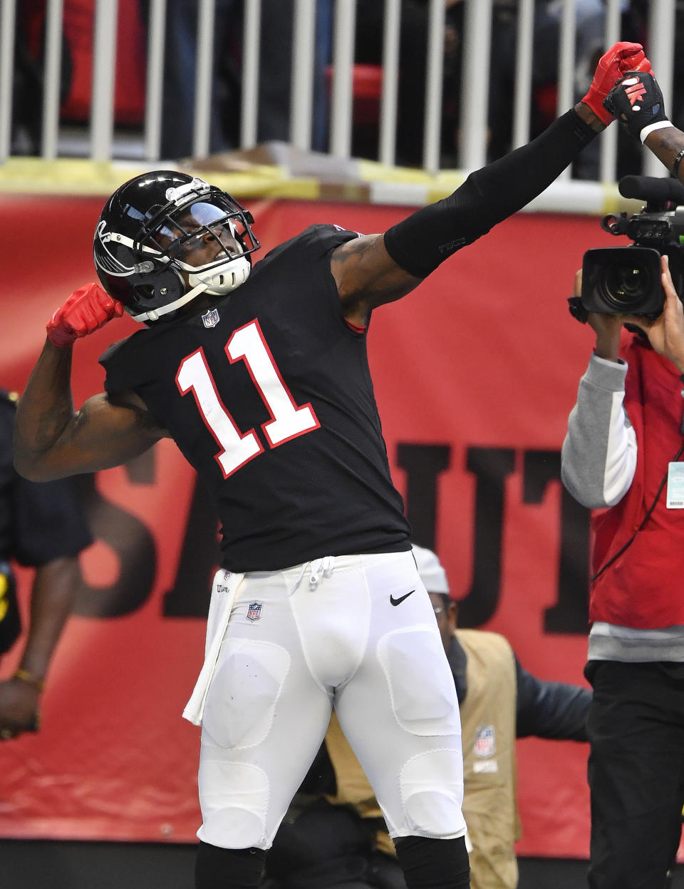 Atlanta Falcons wide receiver Julio Jones (11) celebrates his touchdown catch in the end zone against the Dallas Cowboys during the second half of an NFL football game, Sunday, Nov. 18, 2018, in Atlanta. (AP Photo/John Amis)