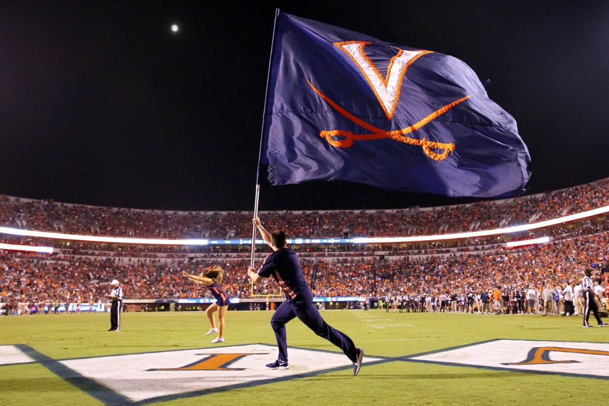 Virginia Cavaliers cheerleaders celebrate a touchdown in the second half during a game against the Florida State Seminoles at Scott Stadium on September 14, 2019 in Charlottesville, Virginia.