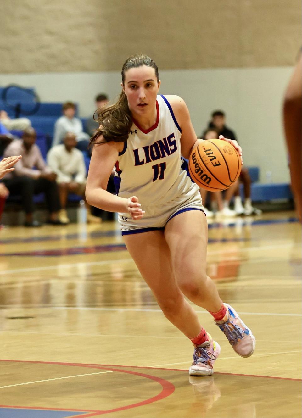 King's Academy girls basketball junior Sophia Kateris (11) drives to the hoop against Windermere Prep in a playoff game on Monday, Feb. 19, 2024 in West Palm Beach.