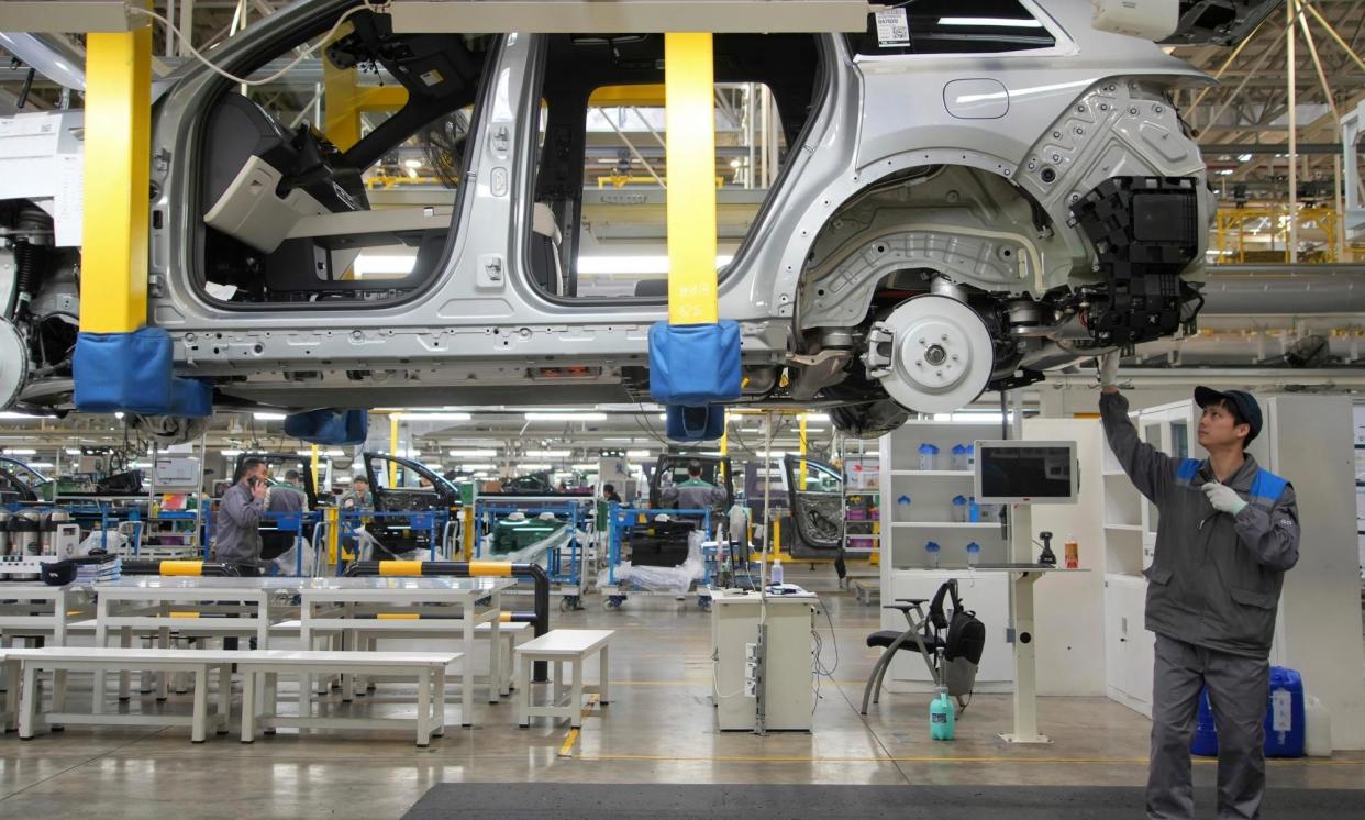 <span> A worker assembles an SUV at a car plant of Li Auto, a major Chinese EV maker, in Changzhou in eastern China. Joe Biden has announced huge new tariffs on the imports on Chinese electric vehicles. </span><span>Photograph: AP</span>