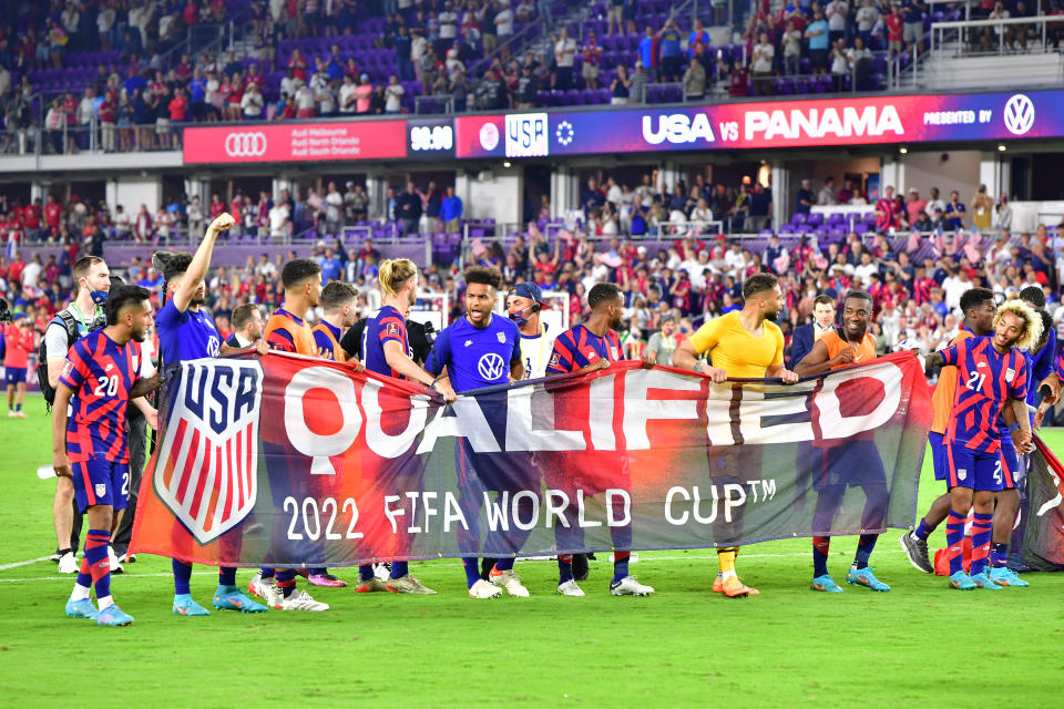 ORLANDO, FLORIDA - MARCH 27: The United States Mens National Team hold a 2022 FIFA World Cup Qualified banner after defeating Panama 5-1 at Exploria Stadium on March 27, 2022 in Orlando, Florida. (Photo by Julio Aguilar/Getty Images)