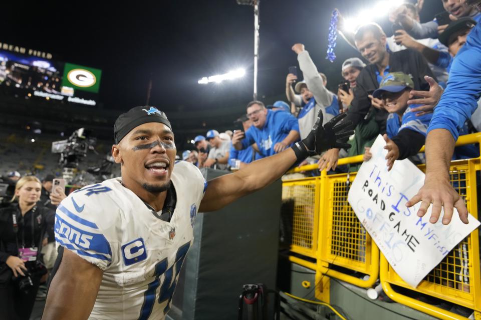 Lions wide receiver Amon-Ra St. Brown celebrates with fans after the 34-20 win on Thursday, Sept. 28, 2023, in Green Bay, Wisconsin.