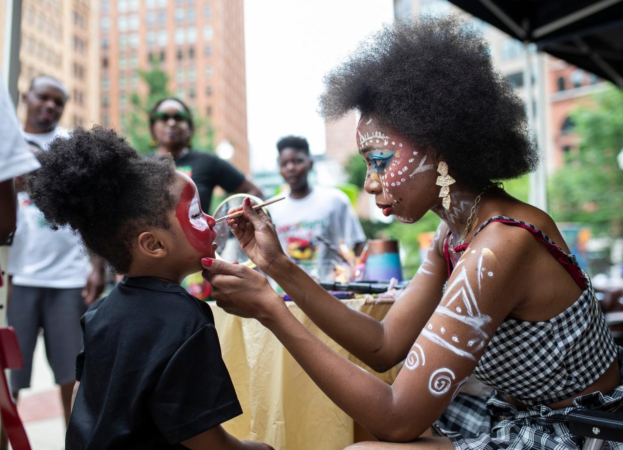 Jacari Morrison, 2, of Detroit, has his face painted as Spider Man during Freedom Day Celebration at the Capitol Park in Detroit on Wednesday, June 19, 2024.