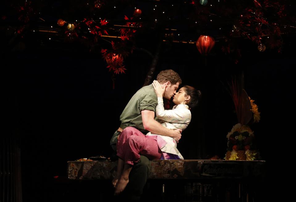 Actors Alistair Brammer and Eva Noblezada perform as Chris and Kim during a photocall for a new production of "Miss Saigon" at the Prince Edward Theatre in London May 19, 2014. The production marks the 25th anniversary of the musical by Claude-Michel Schonberg and Alain Boubil. REUTERS/Luke MacGregor (BRITAIN - Tags: ENTERTAINMENT)