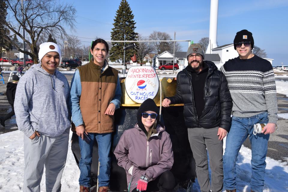 The second-place winning "Let's Scatt to It" team poses with their "outhouse" after the race March 4, 2023.