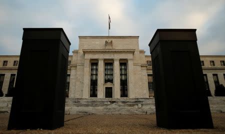 Bollards help secure the entrance to the Federal Reserve in Washington, December 16, 2015. REUTERS/Kevin Lamarque