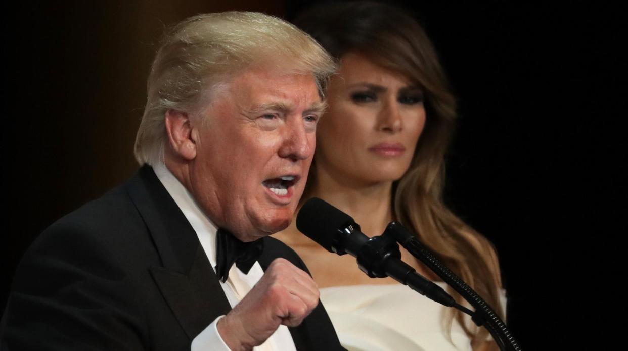 Donald Trump speaks as his wife First Lady Melania Trump looks on during A Salute To Our Armed Services Inaugural Ball at the National Building Museum on January 20, 2017 in Washington: Alex Wong/Getty