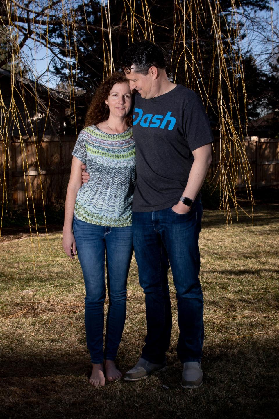 Hollie Quinn and her husband Patrick Quinn pose for a portrait at their home in Fort Collins on March 24.