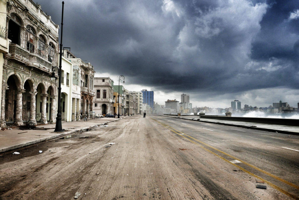 <p>Havana’s Malecon waterfront is closed to traffic, three days after Hurricane Irma passed over Cuba, on Sept. 12, 2017, in Havana, Cuba. Hundreds of thousands still have no power as Cuba is recovering from the impact by hurricane Irma. (Photo: Sven Creutzmann/Mambo photo/Getty Images) </p>
