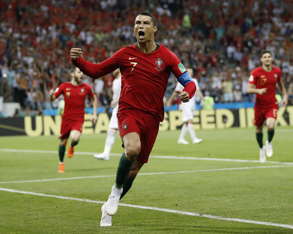 Portugal’s Cristiano Ronaldo celebrates after scoring against Spain during World Cup Group B action. (AP)