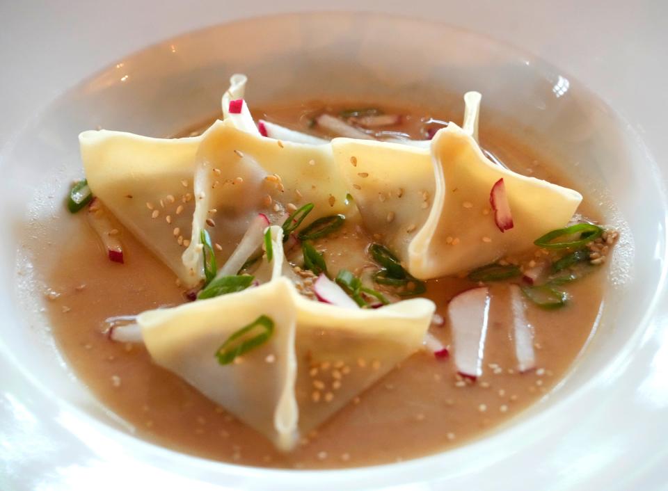 The Original's delicate steamed duck dumplings with chili oil, radish, and miso broth pack a pleasant amount of heat.