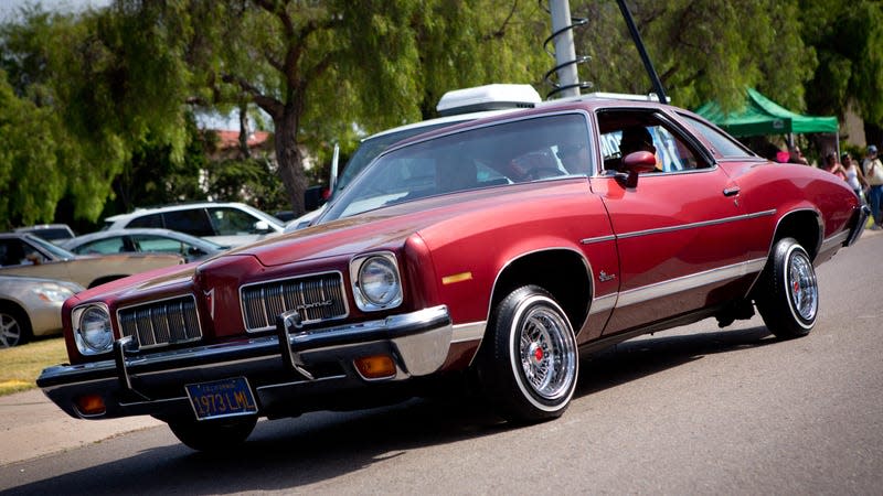 Lowriders with modified hydraulic suspension system, which can ride very low or even jump at the flip of a switch, on Cinco de Mayo, a Mexican-American holiday in San Diego.