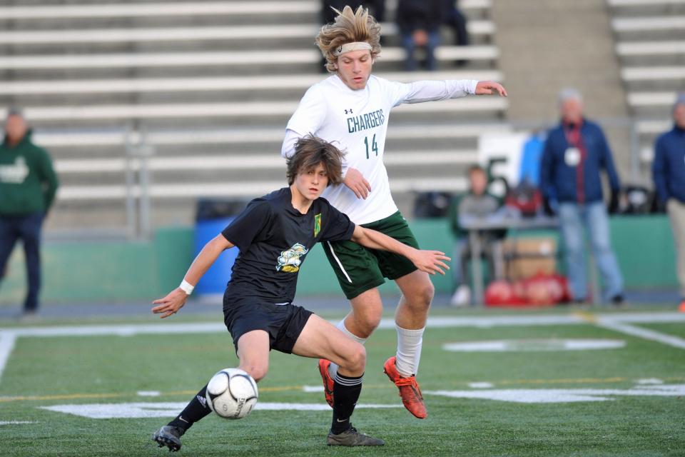 North Smithfield's Aidan Bienvenue, left, wards off Chariho's Nate Allen during the Division II title match last season.