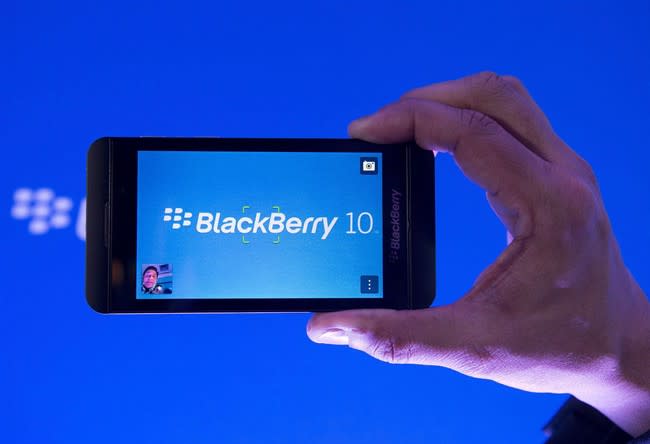 Arun Kumar, a senior product manager for BlackBerry, shows off the new BlackBerry Z10 during the global launch of the company's new smartphones in Toronto on Wednesday, Jan. 30, 2013. BlackBerry Ltd. reports it had a staggering US$4.4-billion net loss from continuing operations in its latest quarter as the company recorded a number of items related to its restructuring efforts. THE CANADIAN PRESS/Nathan Denette, File