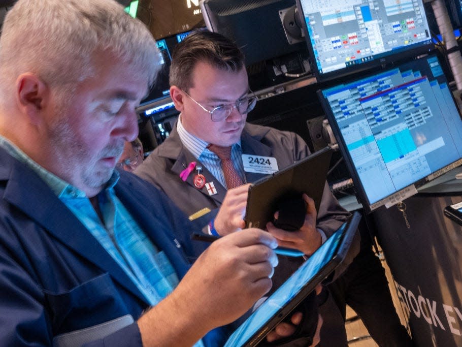 Traders work on the floor of the New York Stock Exchange (NYSE) on March 20, 2024 in New York City.