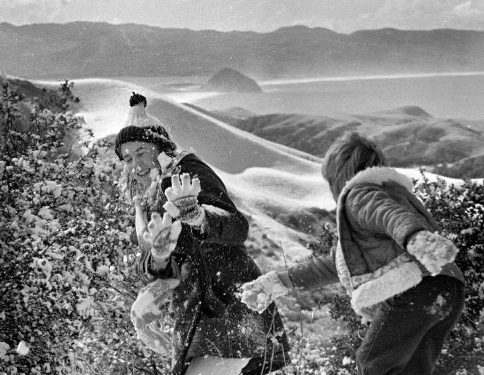 Laura Peterson, left, and Brandee Leonhardt, both of Morro Bay have a snowfight in 1976 on Highway 46, six miles west of Cambria.