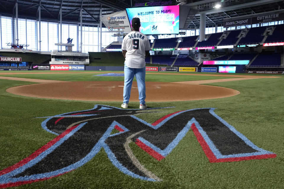 Miami Marlins baseball infielder Jean Segura wears a Marlins jersey as he poses for a photograph, Wednesday, Jan. 11, 2023, at loanDepot Park in Miami. Segura recently signed a two-year deal with the Marlins. (AP Photo/Lynne Sladky)