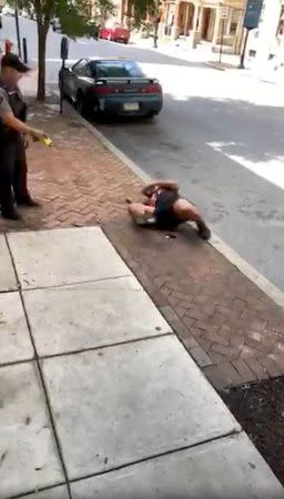 A man gets Tasered by a police officer, in Lancaster, Pennsylvania, U.S., June 28, 2018, in this still image taken from a video obtained from social media. Jay Jay/via REUTERS