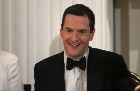 Britain's Chancellor of the Exchequer George Osborne smiles during the Bankers and Merchants Dinner at the Masion House in London, Britain June 10, 2015. REUTERS/Neil Hall