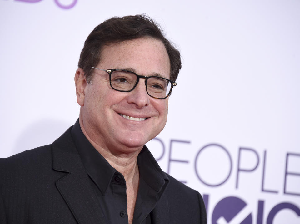 FILE - Bob Saget arrives at the People's Choice Awards at the Microsoft Theater on Wednesday, Jan. 18, 2017, in Los Angeles. Saget, a comedian and actor known for his role as a widower raising a trio of daughters in the sitcom “Full House,” has died, according to authorities in Florida, Sunday, Jan. 9, 2022. He was 65. (Photo by Jordan Strauss/Invision/AP, File)