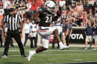 Cincinnati running back Jerome Ford (24) runs into the end zone for a touchdown during the second half of an NCAA college football game against Murray State, Saturday, Sept. 11, 2021, in Cincinnati. (AP Photo/Jeff Dean)