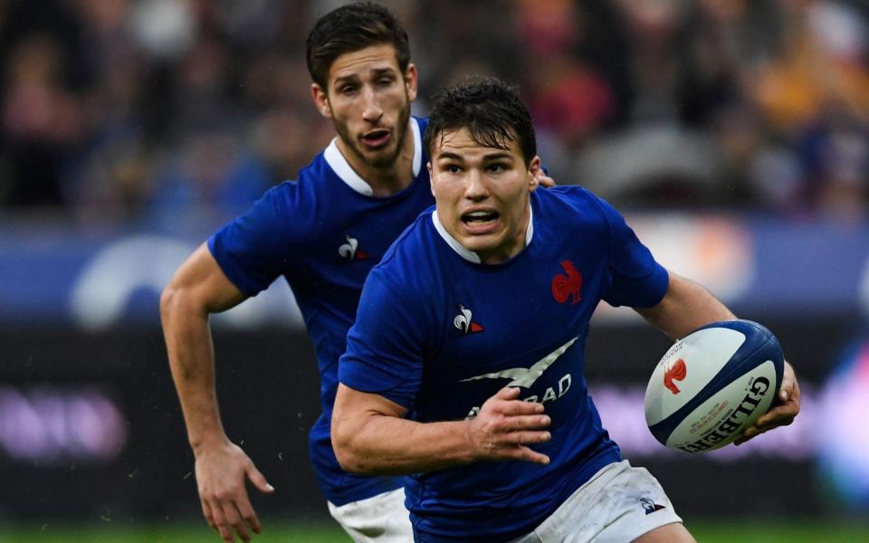 France's scrum-half Antoine Dupont runs with the ball during the Six Nations rugby union tournament match between France and England  - AFP