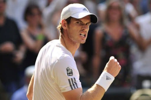 Britain's Andy Murray celebrates winning a point against Serbia's Novak Djokovic in the men's singles final on day thirteen of the 2013 Wimbledon Championships at the All England Club in Wimbledon, southwest London, on July 7, 2013. Djokovic and Murray have now contested three of the last four Grand Slam finals