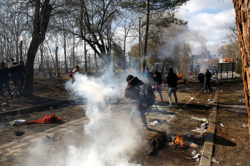 Tear gas floats in the air during clashes between migrants and Greek police, at the Turkey's Pazarkule border crossing with Greece's Kastanies, in Edirne