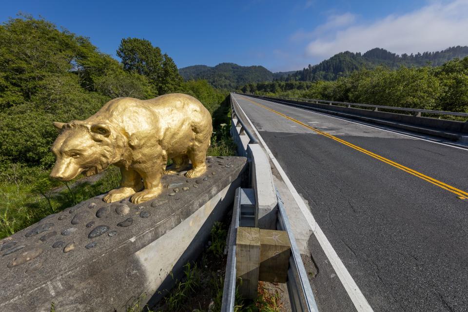 The Golden Bear Statue on a bridge crossing the Klamath River in California.