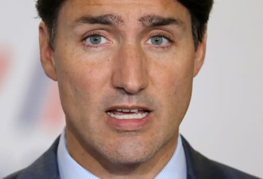 Canada's Prime Minister Justin Trudeau announced two measures aimed at wooing middle-class voters but once again had to defend himself after images showing him in blackface emerged