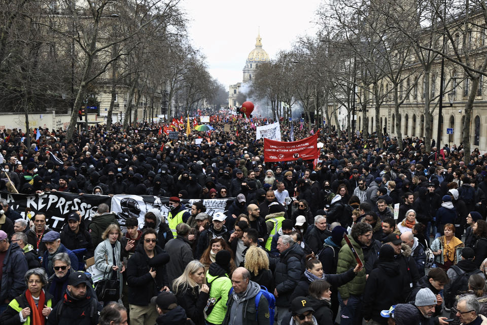 Protesters march during a demonstration in Paris, France, Wednesday, March 15, 2023. Opponents of French President Emmanuel Macron's pension plan are staging a new round of strikes and protests as a joint committee of senators and lower-house lawmakers examines the contested bill. (AP Photo/Aurelien Morissard)