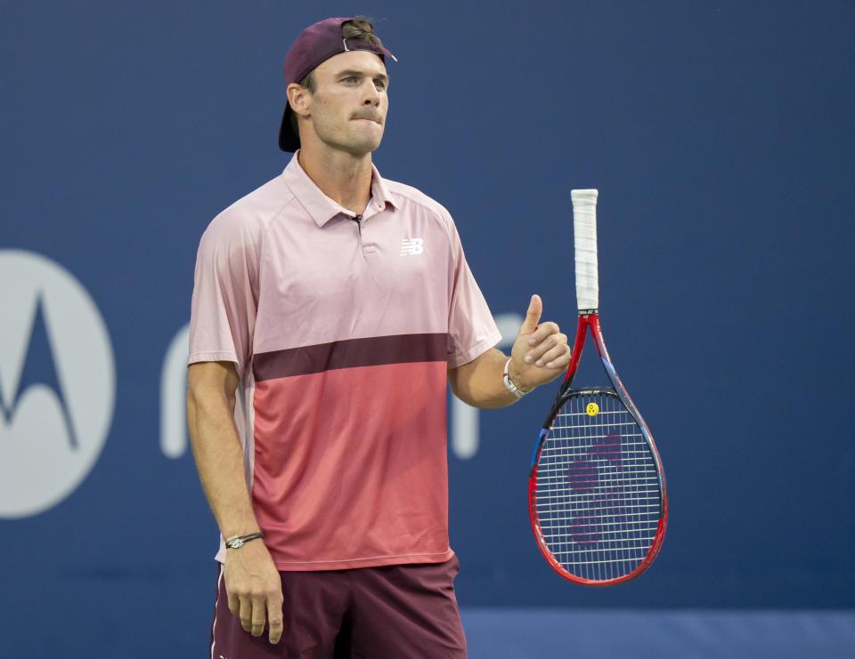 Tommy Paul, of the United States, flips his racket while waiting for a serve from Carlos Alcaraz, of Spain, during the National Bank Open men’s tennis tournament Friday, Aug. 11, 2023, in Toronto. (Frank Gunn/The Canadian Press via AP)