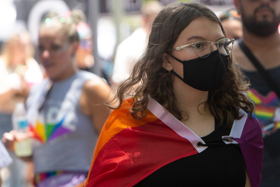 An attendee wears a mask during the 4th Annual Naples Pride Fest, Saturday, July 9, 2022, at Cambier Park in Naples, Fla.