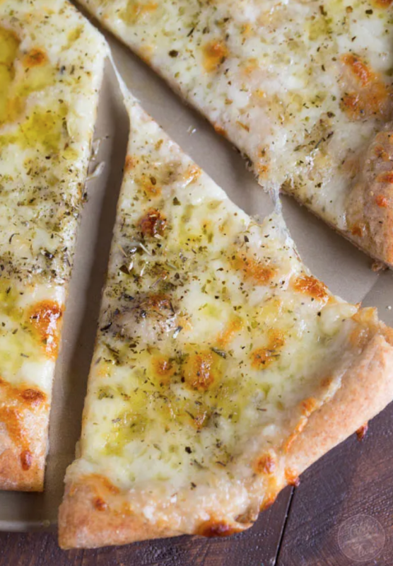 <p>Table for Two</p><p>A classic white pizza with a whole-wheat blend crust is the perfect cheesy, oily and garlic-y pizza for any day of the week!</p><p><strong>Get the recipe: <a href="https://www.tablefortwoblog.com/white-pizza/" rel="nofollow noopener" target="_blank" data-ylk="slk:Classic White Pizza;elm:context_link;itc:0;sec:content-canvas" class="link ">Classic White Pizza</a></strong></p>