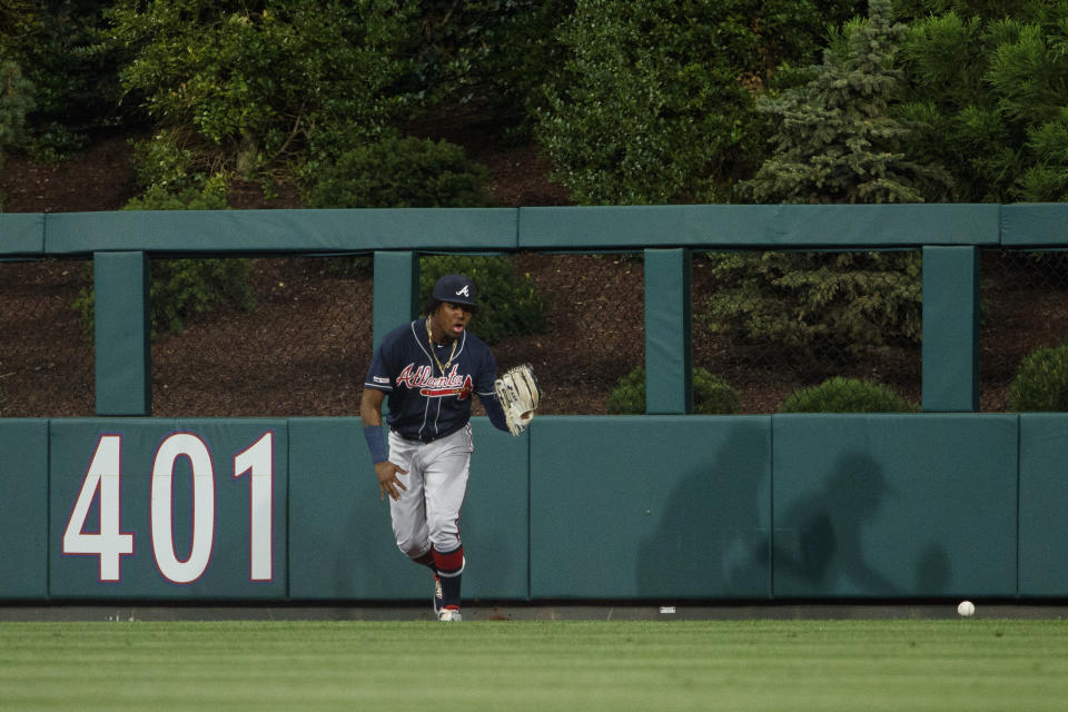 Atlanta Braves center fielder Ronald Acuna Jr. cannot hang onto an inside the park home run by Philadelphia Phillies' Scott Kingery during the third inning of a baseball game, Tuesday, Sept. 10, 2019, in Philadelphia. (AP Photo/Matt Slocum)