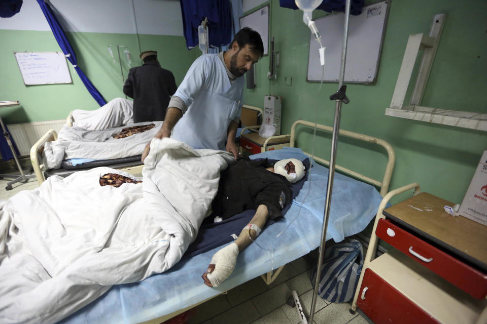 Injured men recover at a hospital after a suicide attack in Kabul, Afghanistan, Wednesday, March 1, 2017. A pair of suicide bombings, both claimed by the Taliban, struck the Afghan capital, an Afghan official said. (AP Photo/Rahmat Gul)