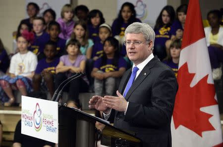 Canada's Prime Minister Stephen Harper speaks during the Saving Every Woman, Every Child: Within Arm's Reach Summit at Davisville Public School in Toronto, Ontario, May 29, 2014. REUTERS/Aaron Harris