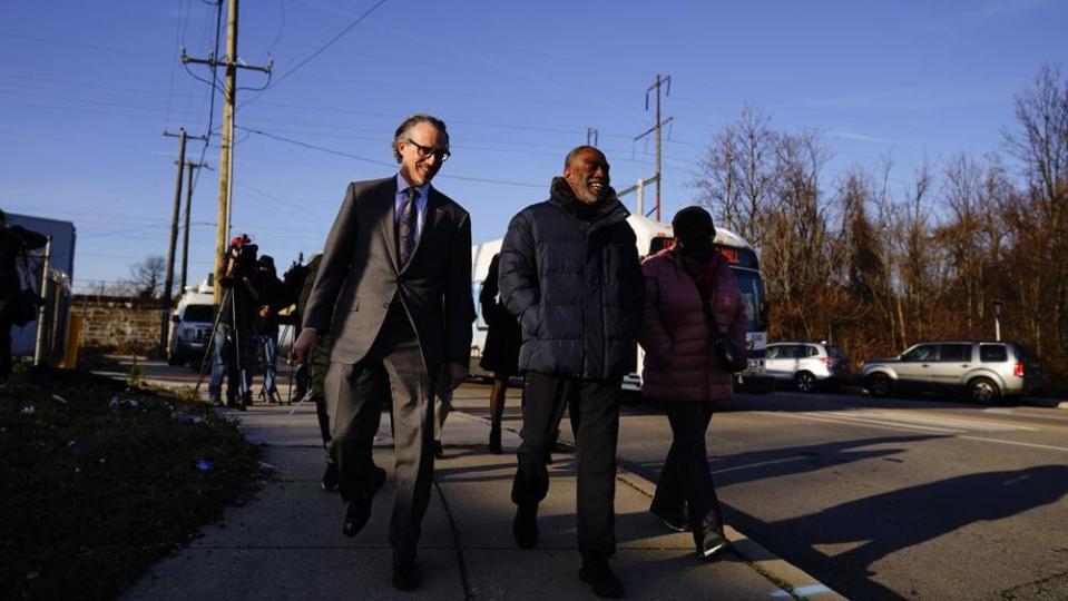 Willie Stokes, center, and lawyer Michael Diamondstein walk in Chester, Pa., on Tuesday, Jan. 4, 2022, after Stokes’ 1984 murder conviction was overturned (AP Photo/Matt Rourke)