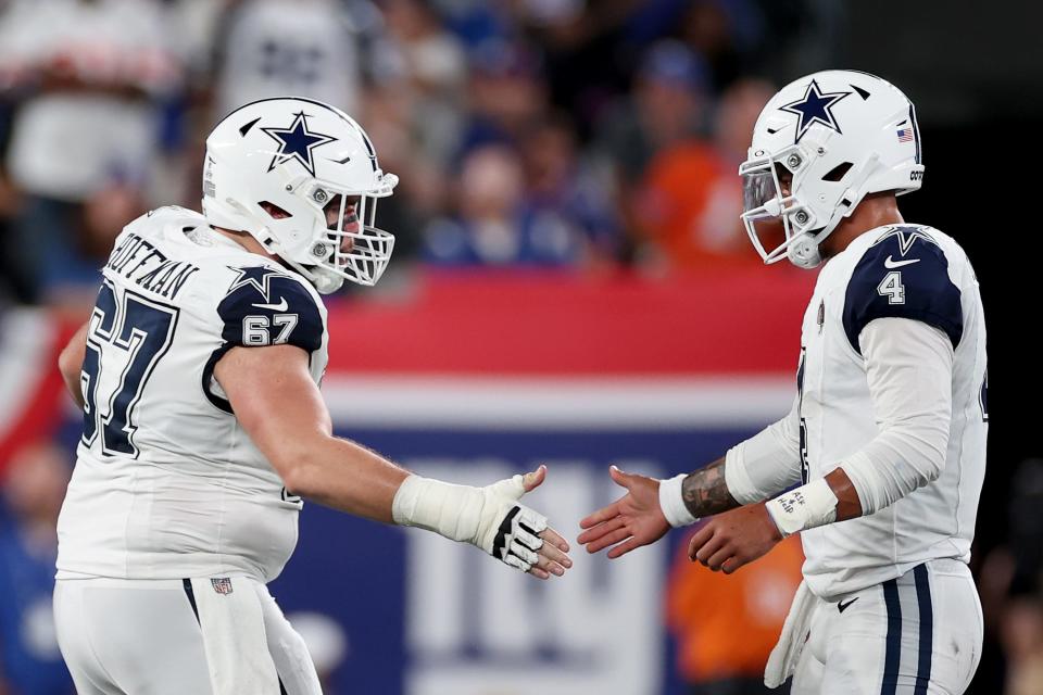 EAST RUTHERFORD, NEW JERSEY - SEPTEMBER 26: Dak Prescott #4 of the Dallas Cowboys celebrates a touchdown with Brock Hoffman #67 during the second quarter against the New York Giants at MetLife Stadium on September 26, 2024 in East Rutherford, New Jersey. (Photo by Sarah Stier/Getty Images)