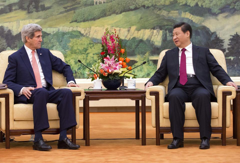 U.S. Secretary of State John Kerry, left, meets with Chinese President Xi Jinping at the Great Hall of the People in Beijing, China Friday, Feb. 14, 2014. Kerry is meeting senior Chinese officials on Friday in Beijing to seek their help in bringing a belligerent North Korea back to nuclear disarmament talks. (AP Photo/Evan Vucci, Pool)