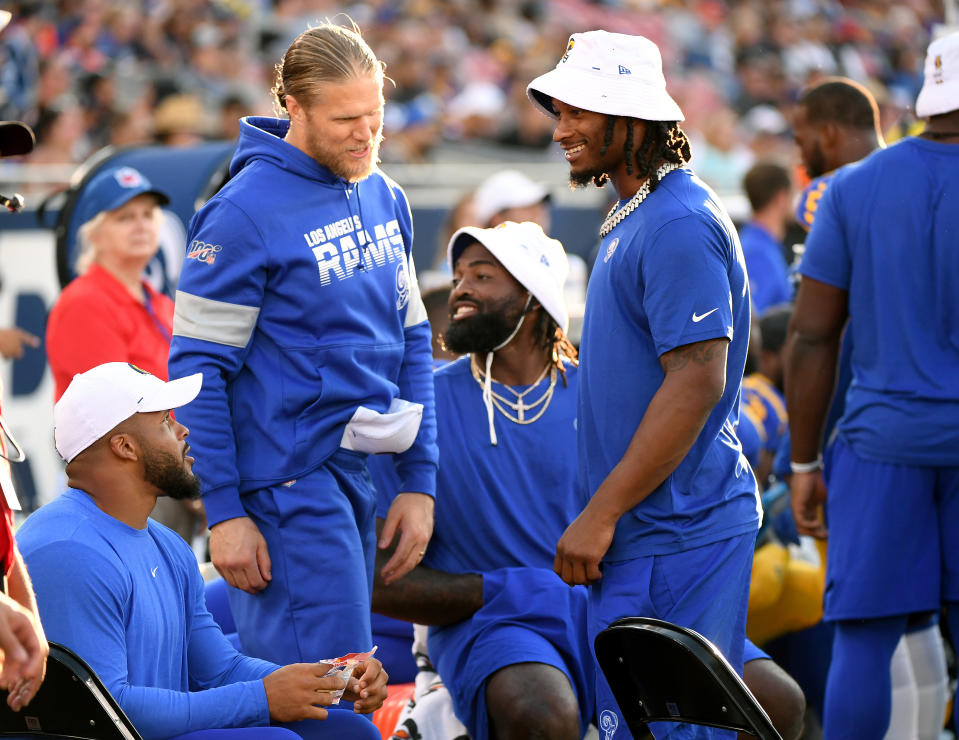 LOS ANGELES, CALIFORNIA - AUGUST 24:  Todd Gurley #30, speaks with Clay Matthews #52 and Aaron Donald #99 on the sidelines during a preseason game against the Denver Broncos at Los Angeles Memorial Coliseum on August 24, 2019 in Los Angeles, California. (Photo by Harry How/Getty Images)