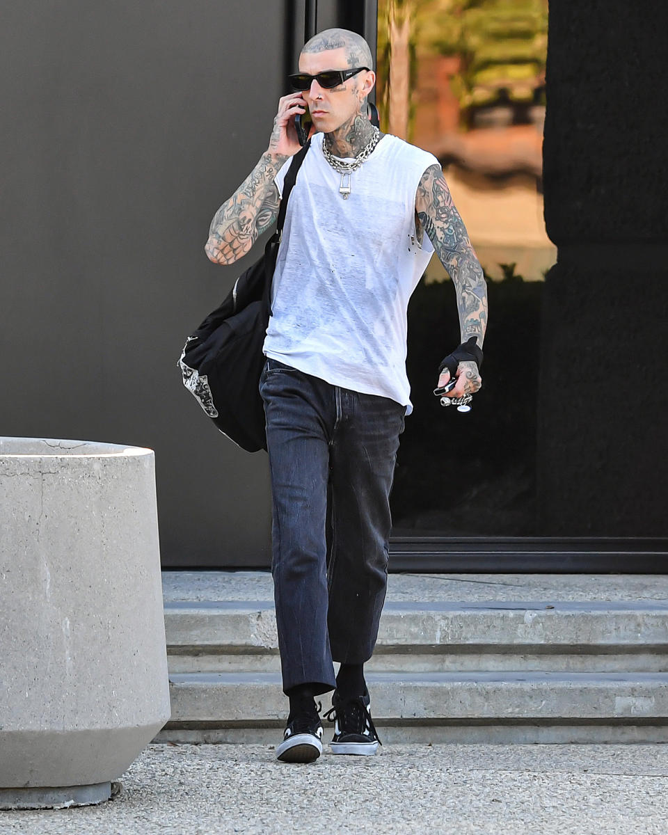 <p>Travis Barker is back in action on July 6, stepping out of a music studio in L.A. following his recent hospitalization. </p>