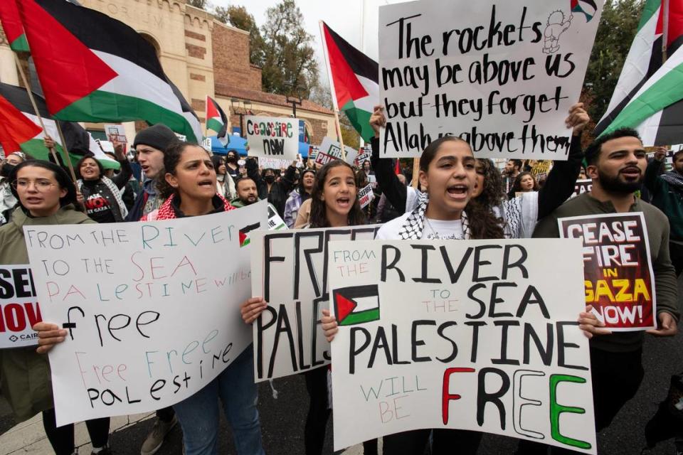 Signs read “From the river to the sea, Palestine will be free” at a protest on Saturday at the Memorial Auditorium in Sacramento, repeating a pro-Palestinian slogan that some consider antisemitic and a call for an eradication of the state of Israel.